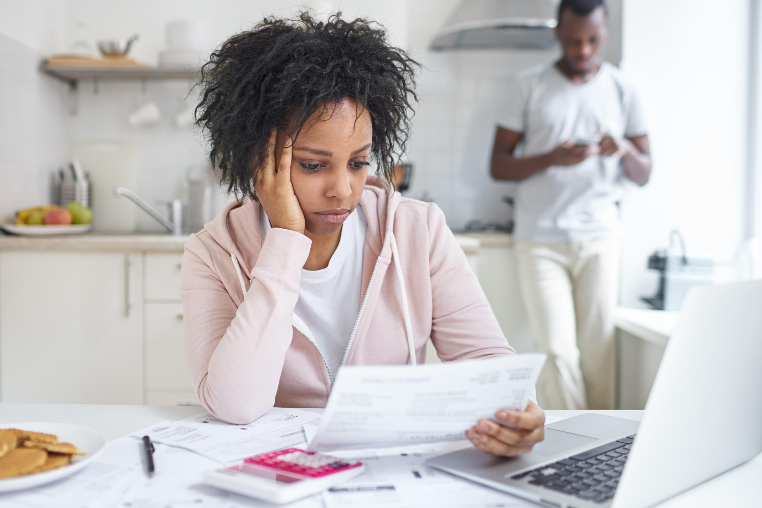 Sad woman looking at insurance plan